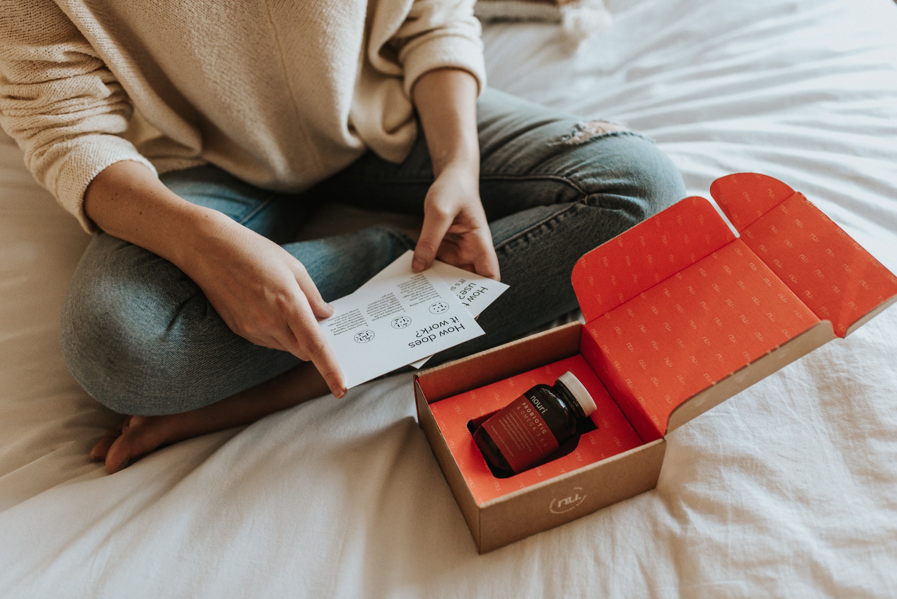 Person unboxing health care brand packaging Person unboxing health care brand packaging