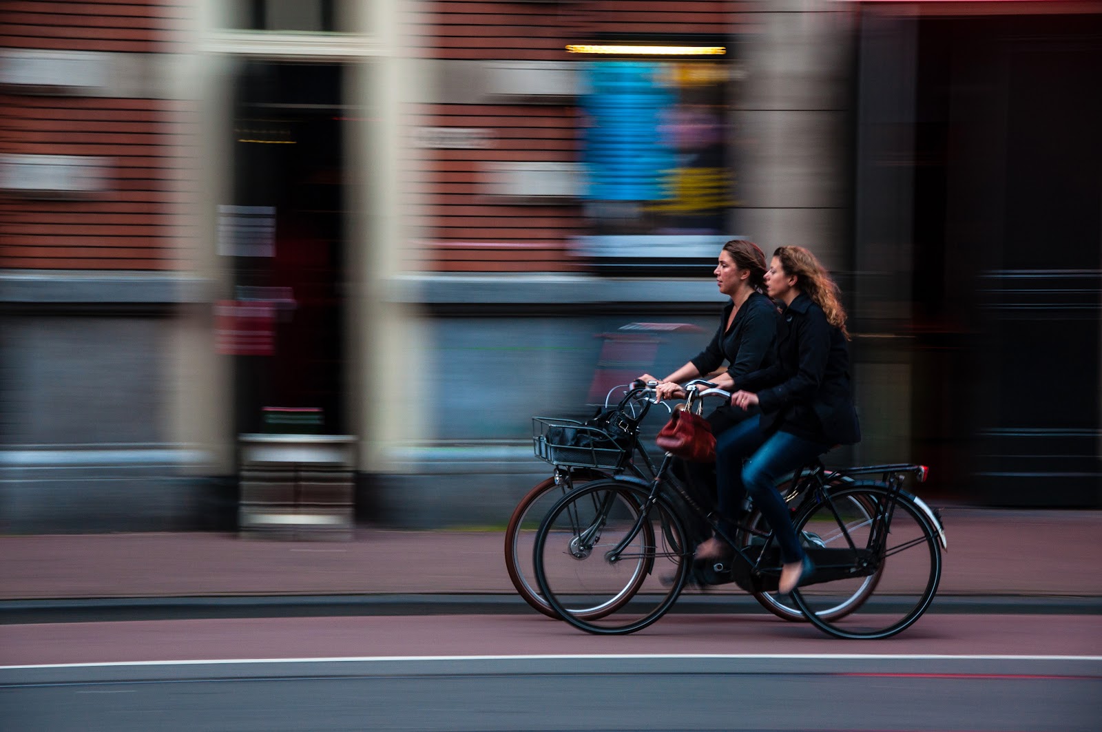 Two women riding bi cycle Two women riding bi cycle