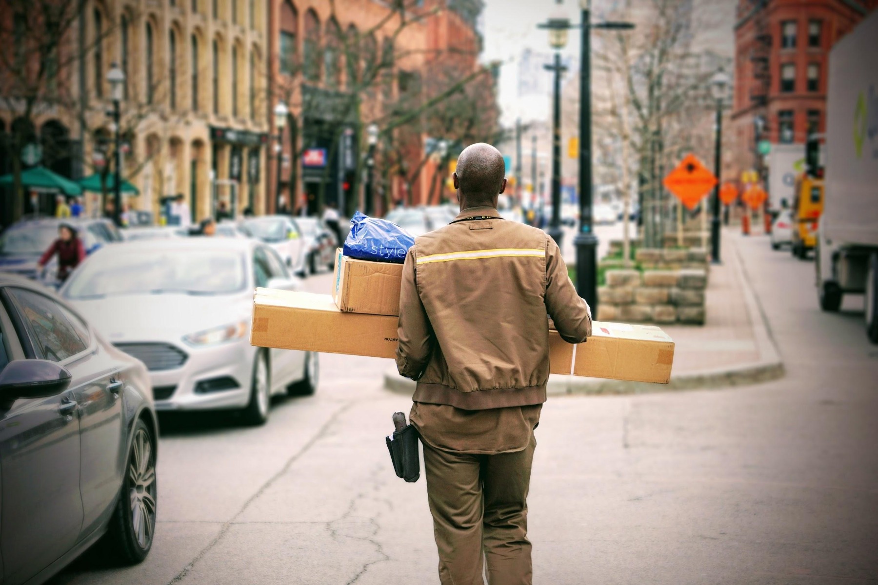 Man delivering packaging boxes Man delivering packaging boxes